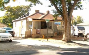 The home in Magna, Utah, where two men were arrested for allegedly planting a bomb under a KSTU vehicle is seen. KSTU