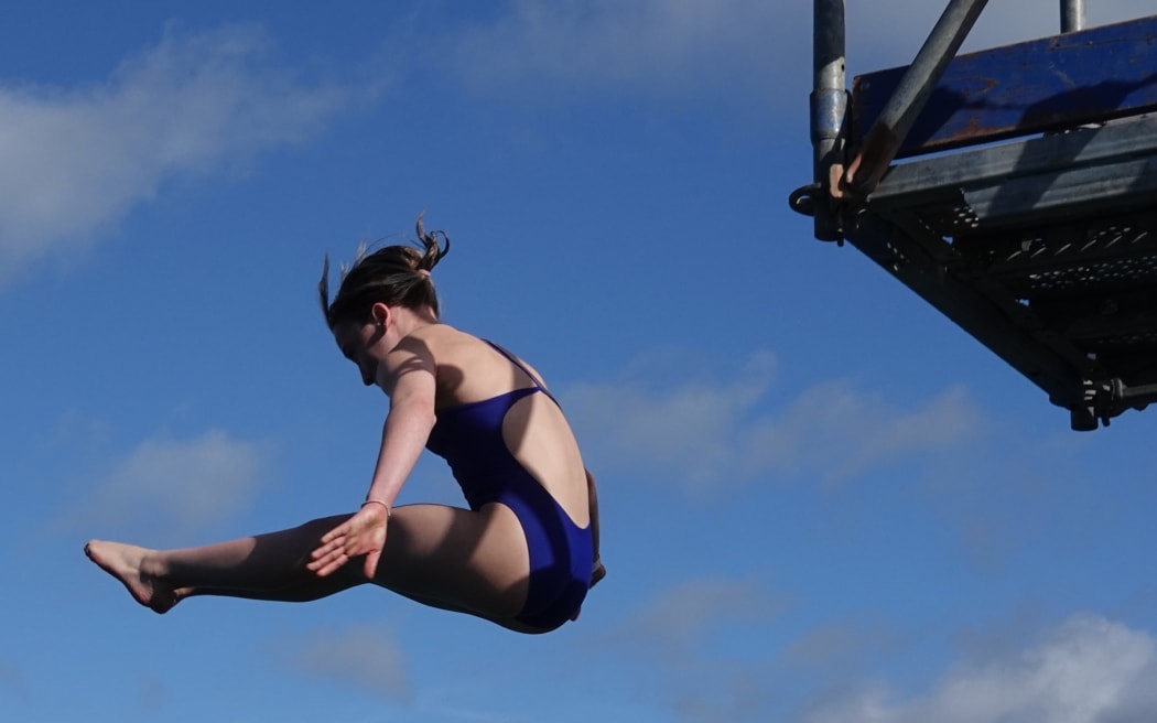 Fourteen-year-old Luka Guthrie, of Auckland, executes a flawless dive from a handstand start