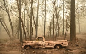 A burnt out truck is seen in Paradise, California after the Camp fire tore through the area.