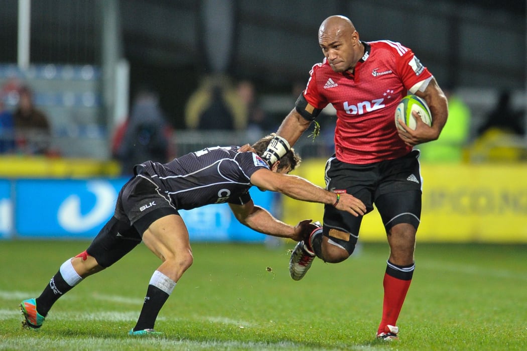 Nemani Nadolo fends off Paul Jordaan during the Crusaders' loss to the Sharks in May 2014