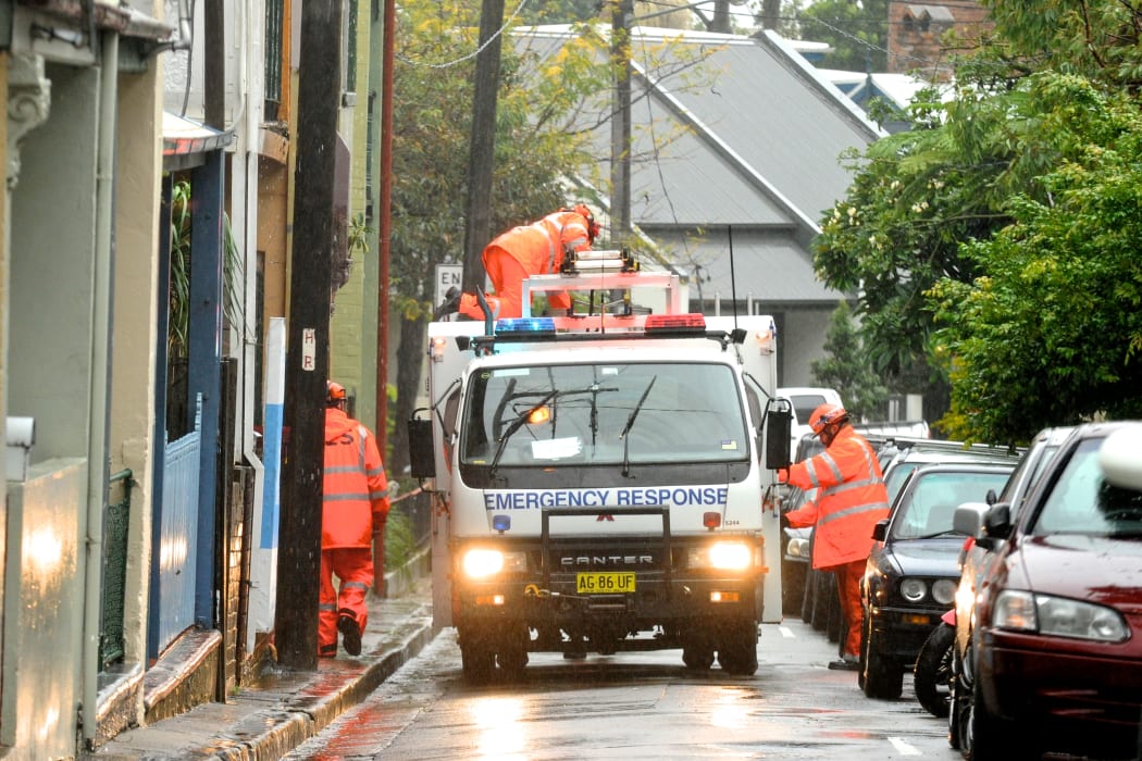 SES crew work to repair a damaged house in Sydney's inner west on Tuesday.
