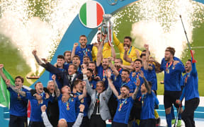 Italy's defender Giorgio Chiellini raises the European Championship trophy  after Italy won the Euro 2020 final football match between Italy and England at Wembley Stadium in London on July 11, 2021.