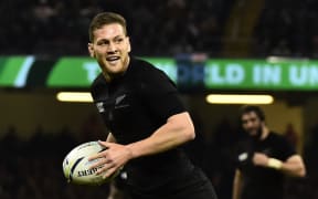 Tawera Kerr-Barlow goes in for his first try during today's Rugby World Cup game between New Zealand and France.