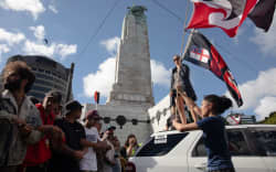 Protestors and Police standoff as police move concrete barricades