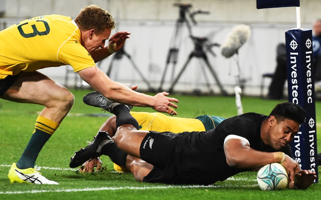 Julian Savea scores a try.
