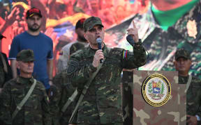 Venezuela's Defense Minister Vladimir Padrino Lopez speaks during a military deployment in support of Venezuela's President Nicolas Maduro at Bolivar Avenue in Caracas on September 23, 2025. Maduro announced that he is considering declaring a "state of external commotion" to deal with "aggressions" from the United States while receiving the support of hundreds of armed civilians and military personnel who marched in his defense in Caracas.