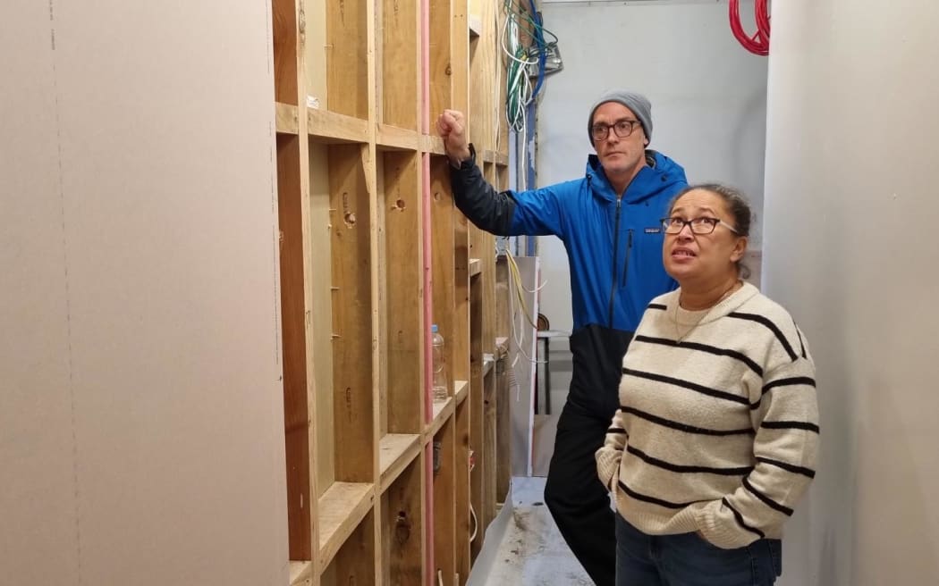 Shelter manager Adam Douglass and YMCA social services manager Kylie Ewing in the under construction men's night shelter and at its entrance. Homeless will be picked up and delivered to the shelter which will be dry.