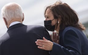 US President Joe Biden (R) and US Vice President Kamala Harris arrive at Dobbins Air Reserve Base in Marietta, Georgia, on March 19, 2021.