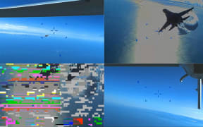 (COMBO) This combination of handout images taken from video released by U.S. European Command (USEUCOM) on March 16, 2023, shows onboard footage from a U.S. Air Force MQ-9 drone as it is approached by a Russian SU-27 aircraft (TOP/L), as the Russian SU-27 aircraft jettissons fuel while approaching the drone (TOP R), at the moment of the collision of the drone with a Russian SU-27 aircraft  (BOTTOM/L), and the drone with a damaged propellor following a collision with the Russian SU-27 aircraft (BOTTOM/R), over The Black Sea on March 14, 2023. - Moscow said that it would try to retrieve the wreckage of a US military drone that crashed over the Black Sea in a confrontation Washington blamed on two Russian fighter jets. Russia also warned that it would react "proportionately" to any future US "provocations" as tensions simmered and Moscow denied its Su-27 military aircraft had clipped the...