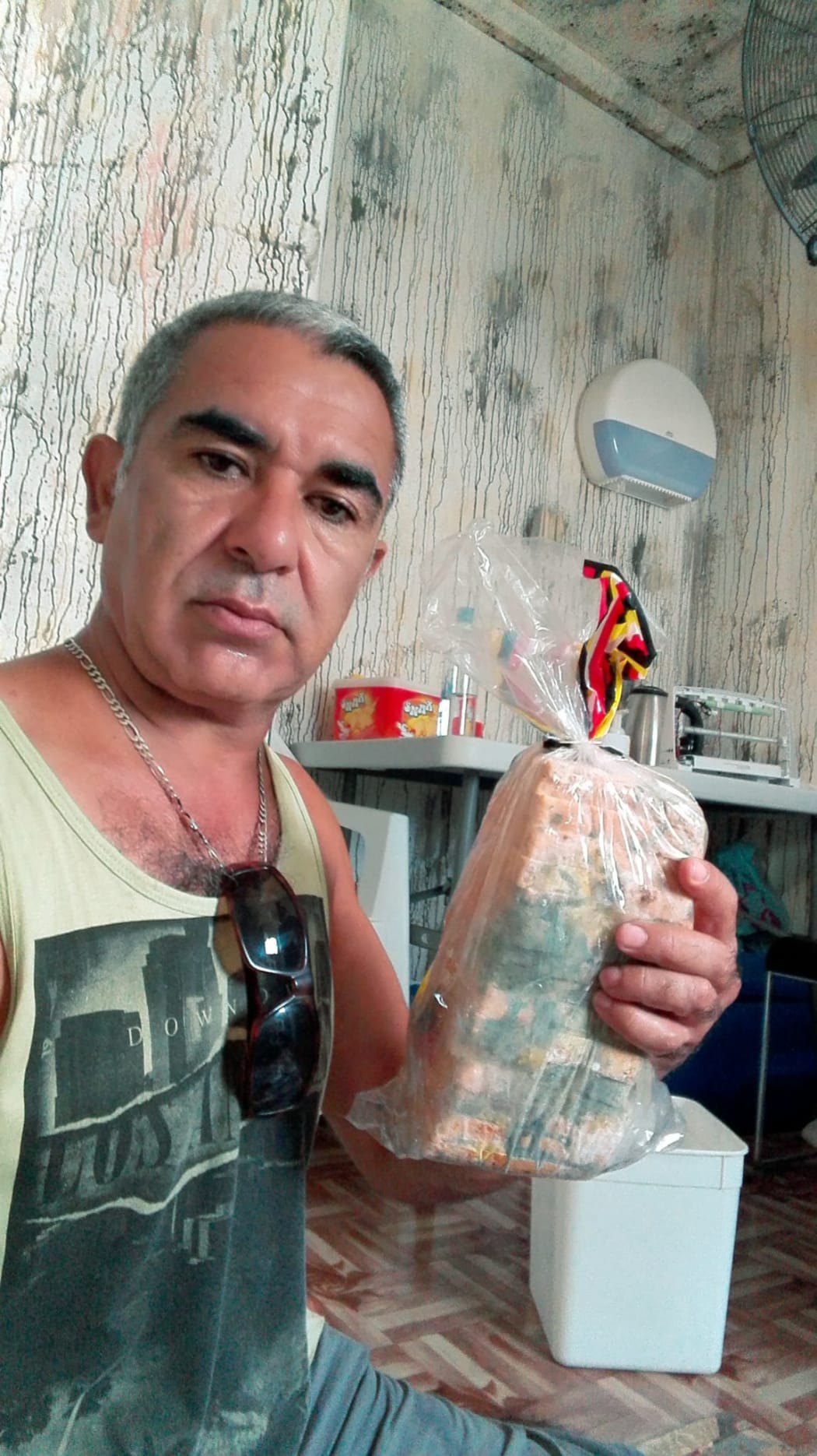 Hassan Ghahramani with a loaf of mouldy bread