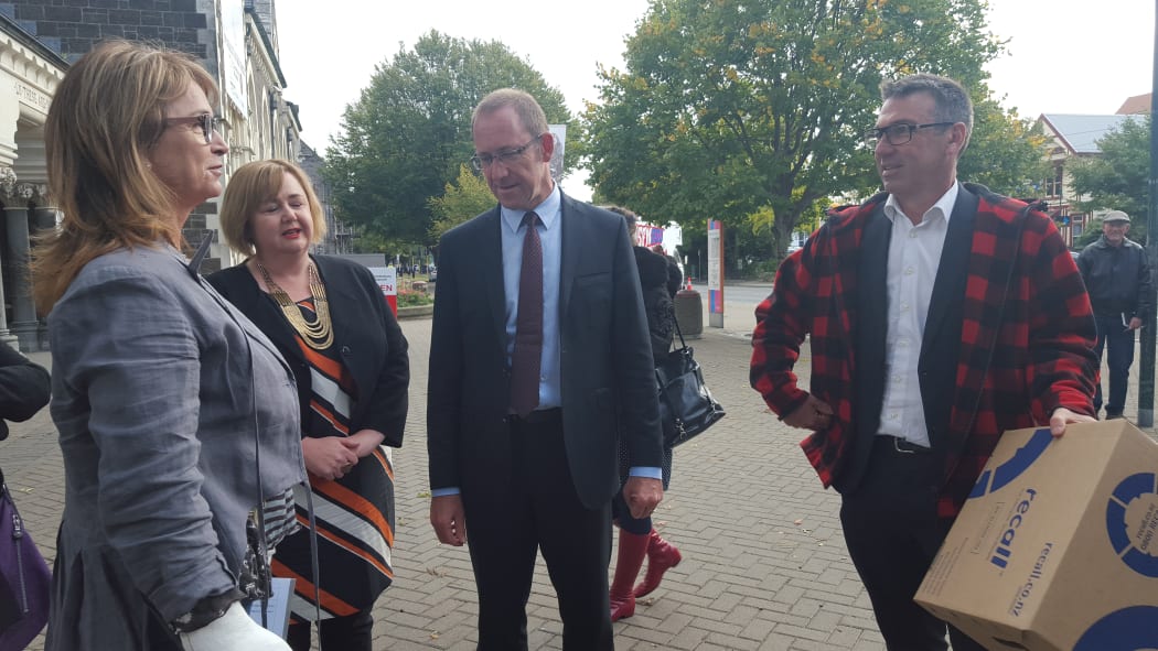 Melanie Tobeck, Megan Woods, Andrew Little and lawyer Duncan Webb, left to right, at the presentation of the petition calling for a Royal Commission of Inquiry into earthquake repairs.
