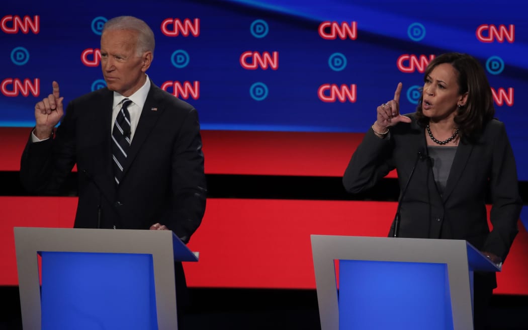 Democratic presidential candidate Sen. Kamala Harris (R) speaks while former Vice President Joe Biden listens during the Democratic Presidential Debate.