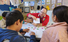 Petone Central School teacher Richard Taylor working with ESOL pupils.