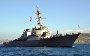 This US Navy handout photo taken on April 29, 2015 shows the USS Laboon (DDG-58) sailing into Souda Bay, Greece, during a scheduled port visit April 29. The US military said on January 14, 2024 that its forces shot down a cruise missile fired at an American destroyer warship from Huthi controlled areas of Yemen. "On January 14 at approximately 4:45 p.m. (Sanaa time) an anti-ship cruise missile was fired from Iranian-backed Huthi militant areas of Yemen toward USS Laboon (DDG 58), which was operating in the Southern Red Sea," the United States Central Command said in a statement. (Photo by Jeffrey RICHARDSON / US NAVY / AFP) / RESTRICTED TO EDITORIAL USE - MANDATORY CREDIT "AFP PHOTO / US NAVY /  Mass Communication Specialist 2nd Class Jeffrey M. Richardson" - NO MARKETING - NO ADVERTISING CAMPAIGNS - DISTRIBUTED AS A SERVICE TO CLIENTS