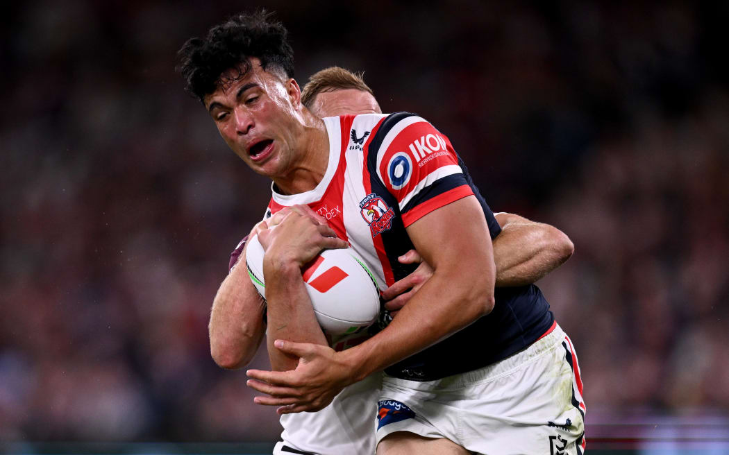 Joseph Suaalii of the Roosters is tackled by Daly Cherry-Evans of the Sea Eagles during the NRL Semi Final match between the Sydney Roosters and the Manly Sea Eagles.