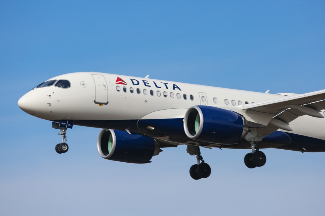Delta Air Lines Airbus A220-100 aircraft as seen on final approach landing with landing gear down at New York JFK John F. Kennedy International Airport on 14 November 2019 in New York, US.