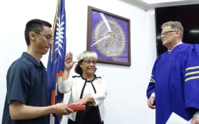 Marshall Islands President Hilda Heine was sworn in Wednesday, January 3, in Majuro for her second term in office, following a four-year hiatus. She was assisted by son Ryan Jetnil, left, and Marshall Islands Supreme Court Chief Justice Daniel Cadra