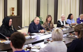 Russian President Vladimir Putin participates in a meeting with mothers of Russia's servicemen participating in the military operation in Ukrain, on November 25, 2022.