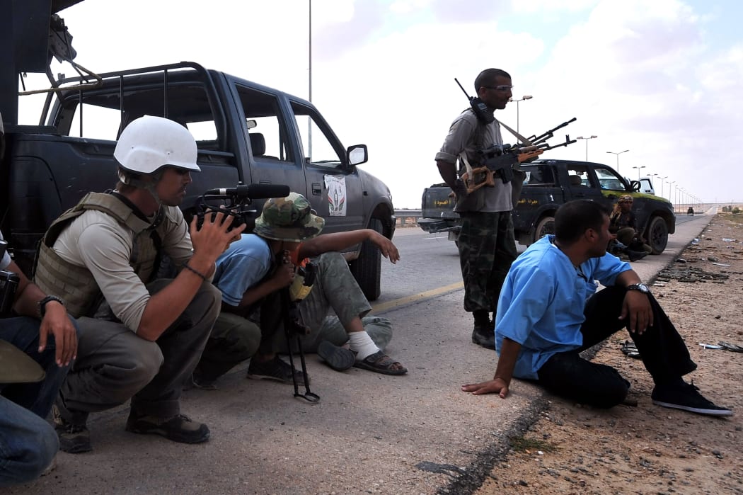A photo taken on September 29, 2011 shows James Foley on the highway between the airport and the West Gate of Sirte, Libya.