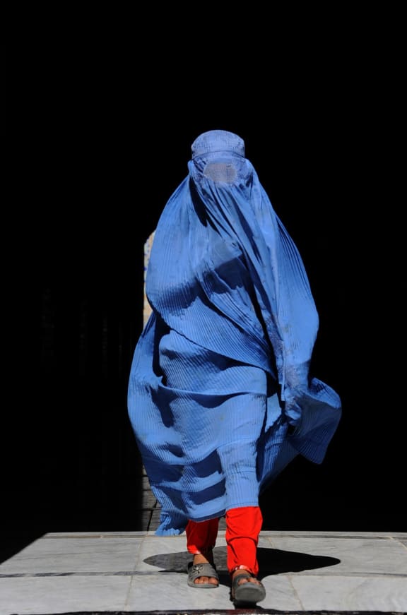 A burka-clad woman.