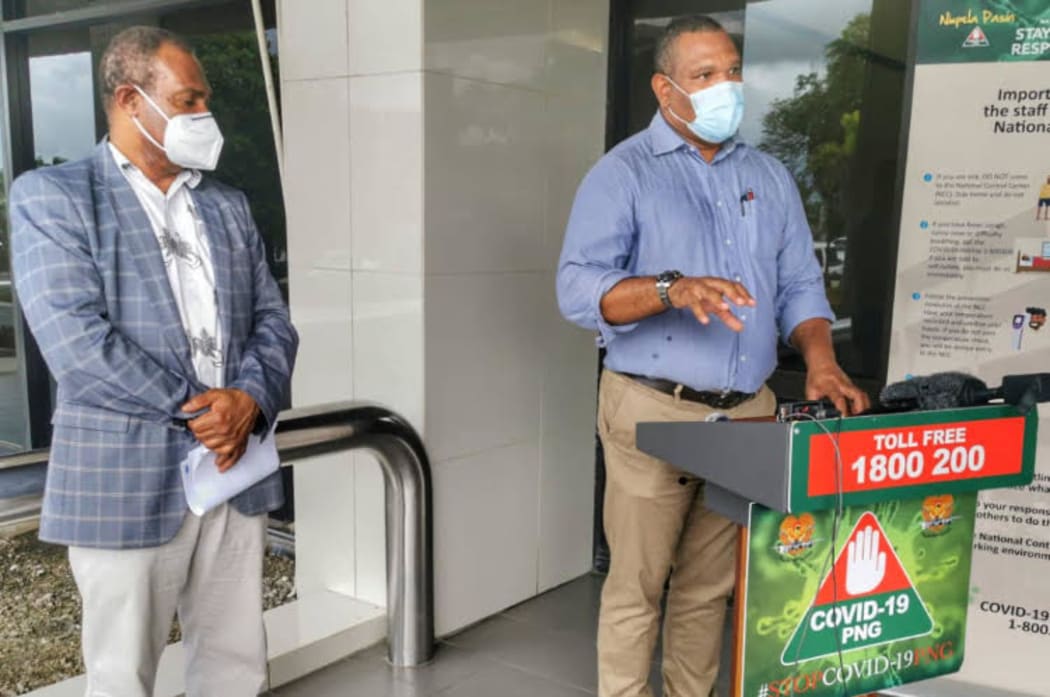 Papua new Guinea's Health Secretary, Osborne Liko (left) and National Pandemic Response Controller David Manning address a media update about the country's worrying Covid-19 surge, 27 March, 2021, Port Moresby.