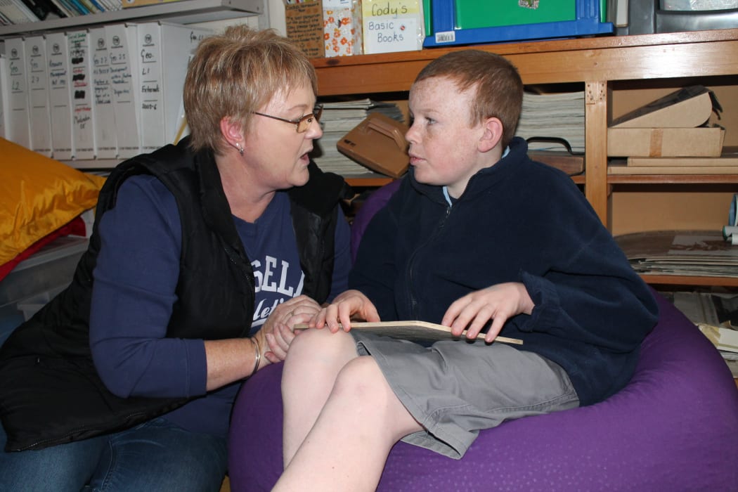 Photo of Cody with one of his teacher aides, Alie Benington