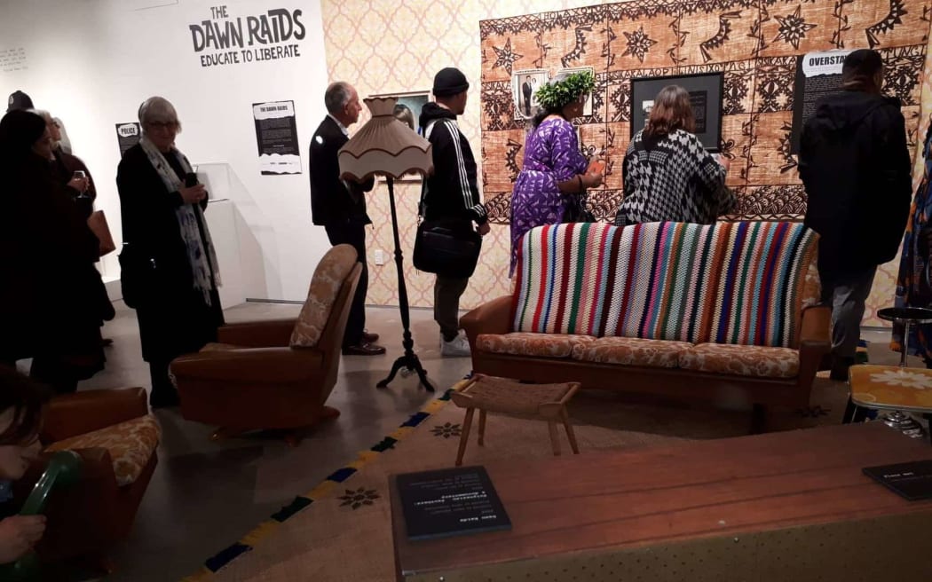 People file through the replica 1970s lounge at the exhibition at Pataka, Porirua.