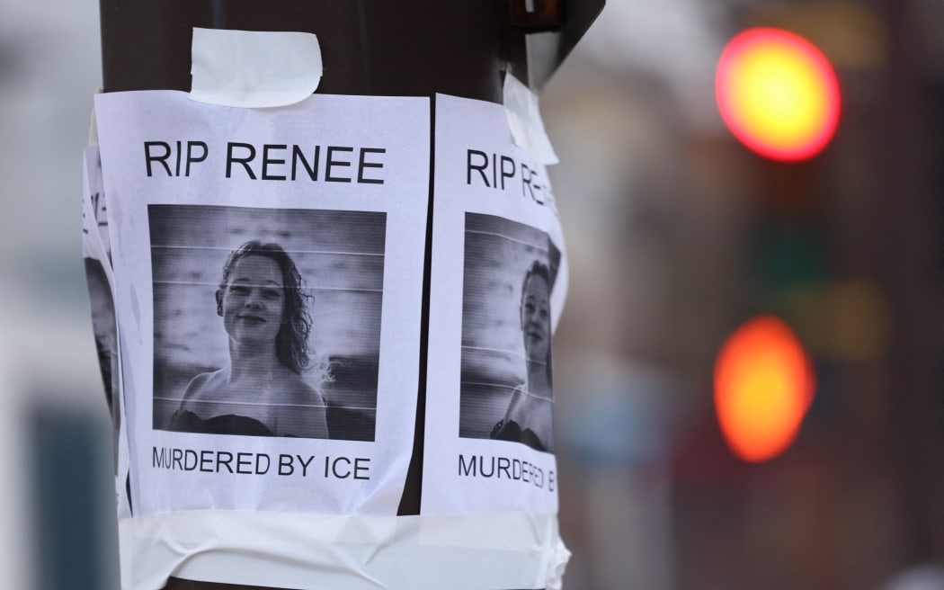 A picture is displayed at a makeshift memorial for Renee Nicole Good, who was shot and killed at point blank range on January 7 by a US Immigration and Customs Enforcement (ICE) agent as she apparently tried to drive away from agents who were crowding around her car, in Minneapolis, Minnesota, on January 8, 2026. A US Immigration and Customs Enforcement (ICE) agent shot and killed an American woman on the streets of Minneapolis January 7, leading to huge protests and outrage from local leaders who rejected White House claims she was a domestic terrorist. (Photo by CHARLY TRIBALLEAU / AFP)