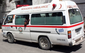 An ambulance arrives as a car bomb detonated in a crowded restaurant located near the city's Central Hotel in Somalia, killing at least five people in Somali capital Mogadishu, on April 21, 2015.