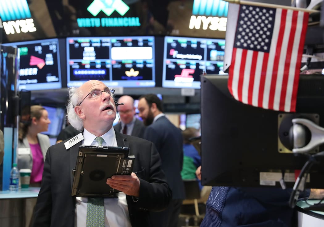 Traders work on the floor of the New York Stock Exchange on 1 November, 2016.