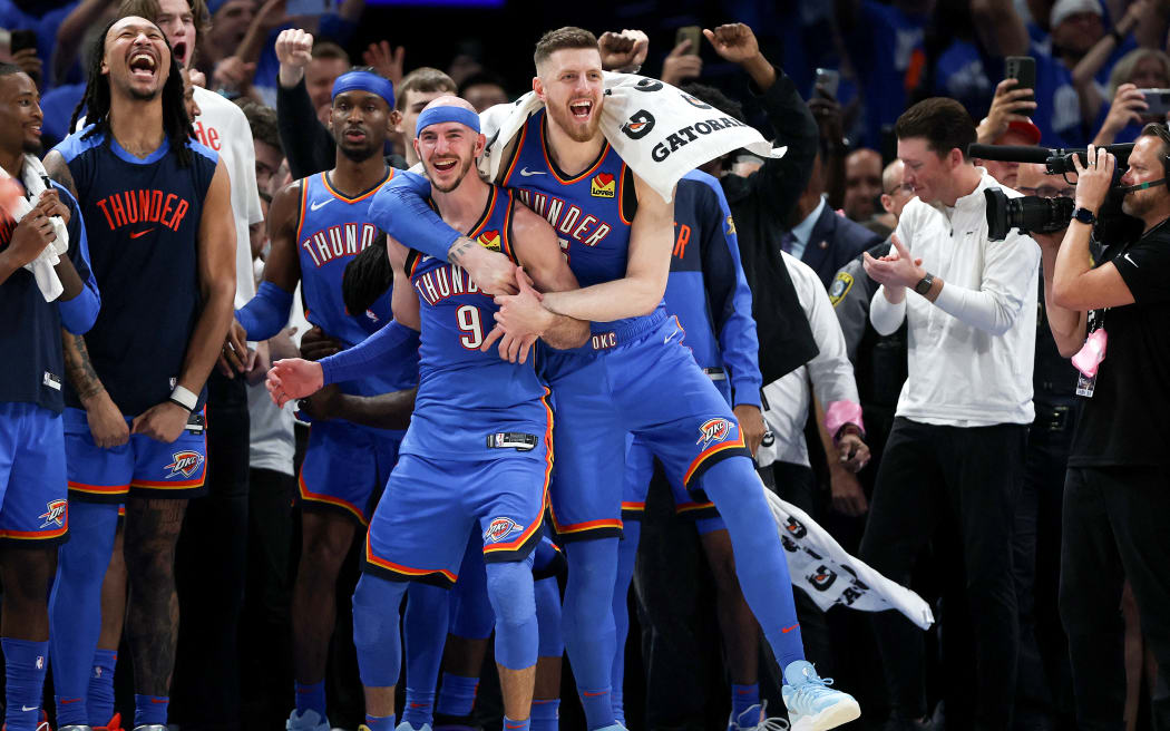 OKLAHOMA CITY, OKLAHOMA - JUNE 22: Alex Caruso #9 and Isaiah Hartenstein #55 of the Oklahoma City Thunder celebrate as their team defeats the Indiana Pacers 103-91 in Game Seven of the 2025 NBA Finals at Paycom Center on June 22, 2025 in Oklahoma City, Oklahoma. NOTE TO USER: User expressly acknowledges and agrees that, by downloading and or using this photograph, User is consenting to the terms and conditions of the Getty Images License Agreement.   Matthew Stockman/Getty Images/AFP (Photo by MATTHEW STOCKMAN / GETTY IMAGES NORTH AMERICA / Getty Images via AFP)