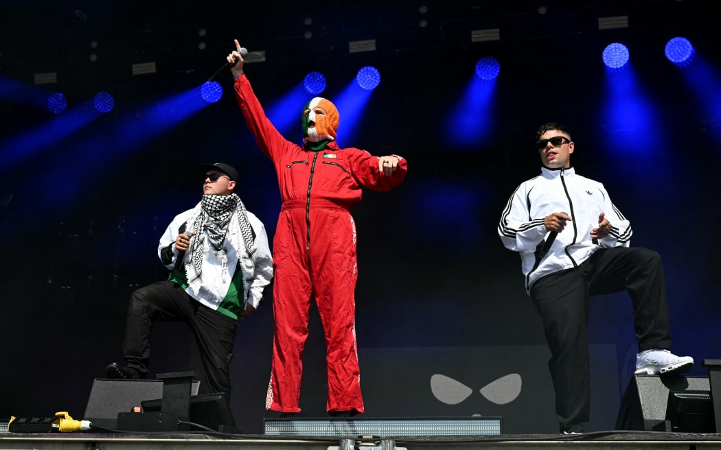 Irish rap band Kneecap perform at the West Holts stage on the fourth day of the Glastonbury festival at Worthy Farm in the village of Pilton in Somerset, south-west England, on June 28, 2025. (Photo by Oli SCARFF / AFP)