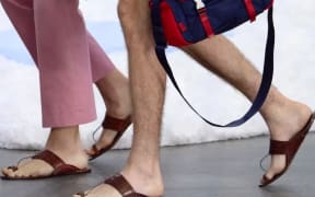 Prada showcases its new leather sandals during the Milan Fashion Week in Italy.