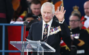 Britain's King Charles gestures during a UK national commemorative event to mark the 80th anniversary commemorations of Allied amphibious landing (D-Day Landings) in France in 1944, in Southsea Common, in Portsmouth, southern England, on June 5, 2024. Heads of state and veterans are due to mark the anniversary of D-Day on June 6, a date that was key to Allied Europe's eventual victory against the Nazis in World War II.