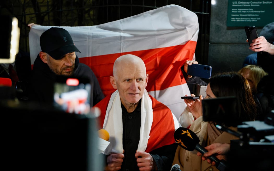 Belarusian Nobel Prize winner Ales Bialiatski speaks to journalists at the US embassy after he was released in Vilnius, Lithuania on December 13, 2025. Belarusian street protest leader Maria Kolesnikova and Nobel Prize winner Ales Bialiatski walked free on on December 13, 2025 with 121 other political prisoners, released in an unprecedented US-brokered deal, rights groups announced. (Photo by Petras Malukas / AFP)