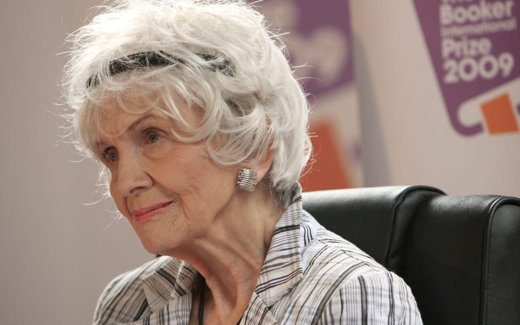 (FILES) Canadian author Alice Munro speaks to the media as she receives her Man Booker International award at Trinity College Dublin, in Dublin, Ireland, on June 25, 2009. The first author of short stories to be awarded the Nobel Prize for Literature, Munro has died at age 92, Canadian media said May 14, 2024. Awarded the Nobel Prize in 2013 as well as the Man Booker International Prize for her body of work in 2009, she had been suffering from dementia in recent years and, according to the Globe and Mail, died May 13 at her care home in Ontario. (Photo by PETER MUHLY / AFP)
