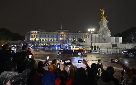 The coffin of Queen Elizabeth II arrives in the Royal Hearse at Buckingham Palace in London, 13 September 2022.