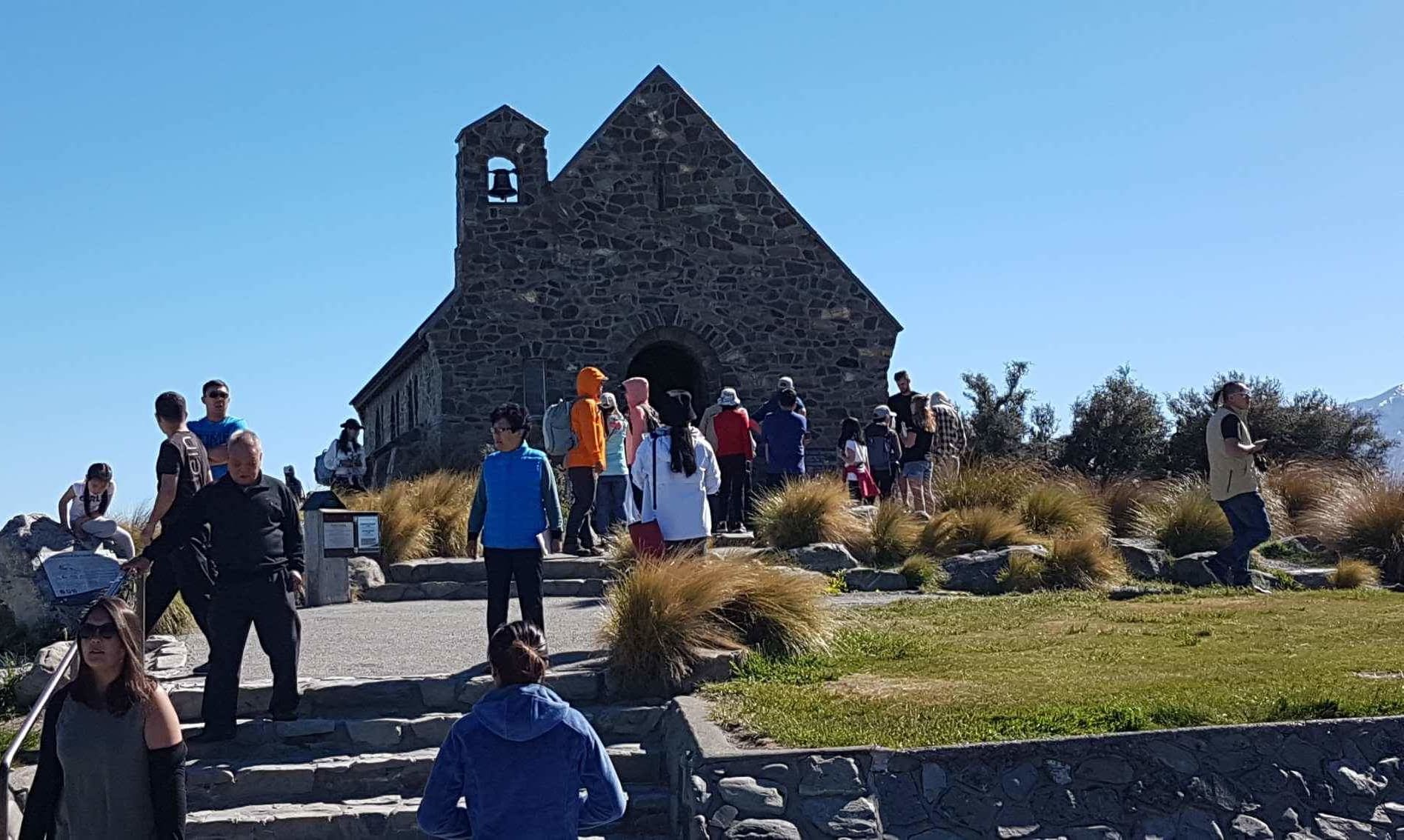 Tourists throng at the church in Tekapo.