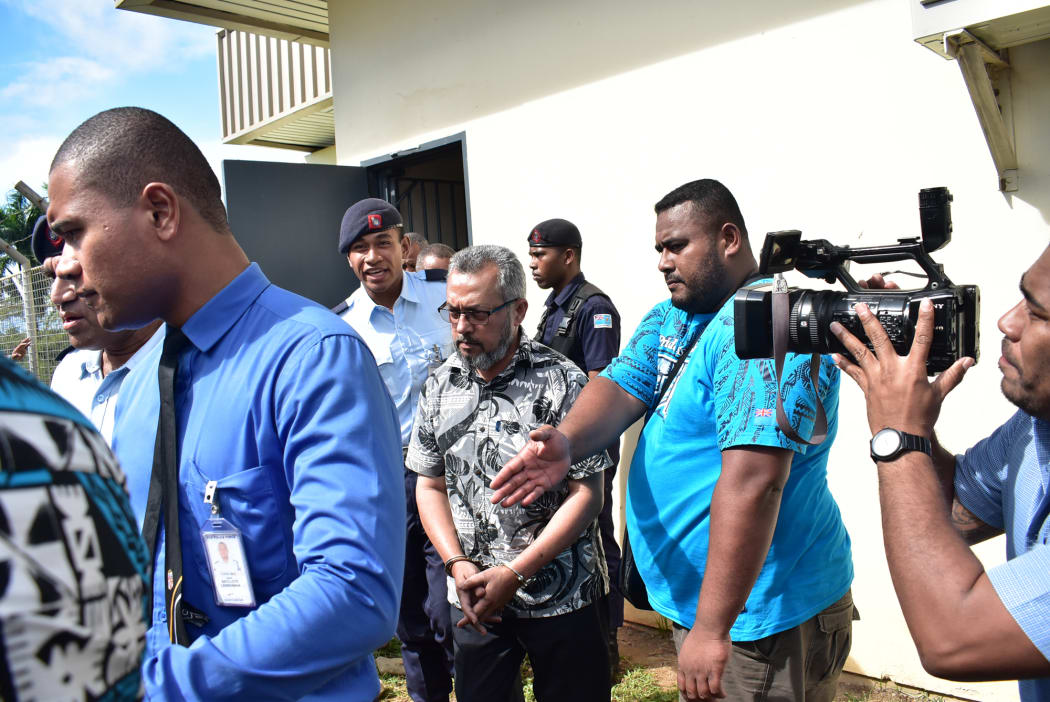 Police officers escort the murder suspect Muhammed Raheesh Isoof to the remand centre from Nadi Magistrates Court on September 18.