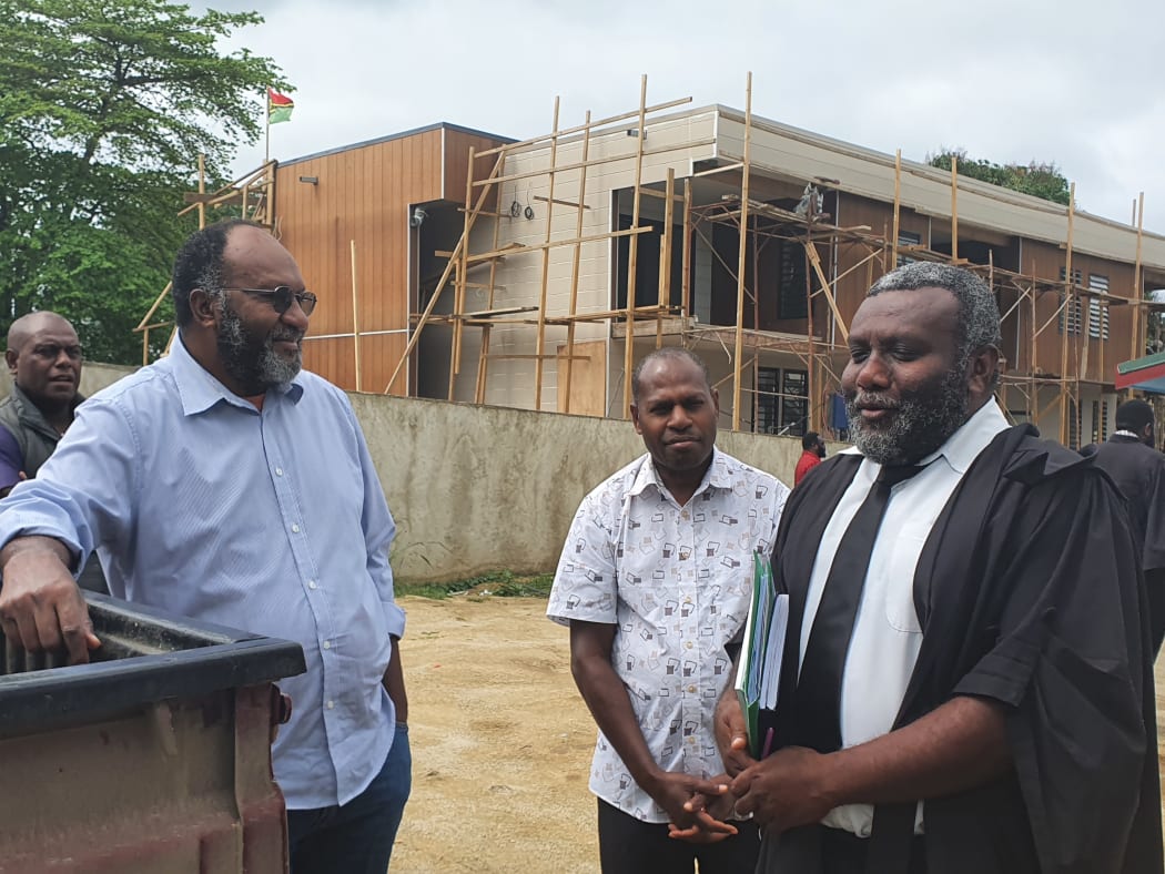 Charlot Salwai and his legal team outside court