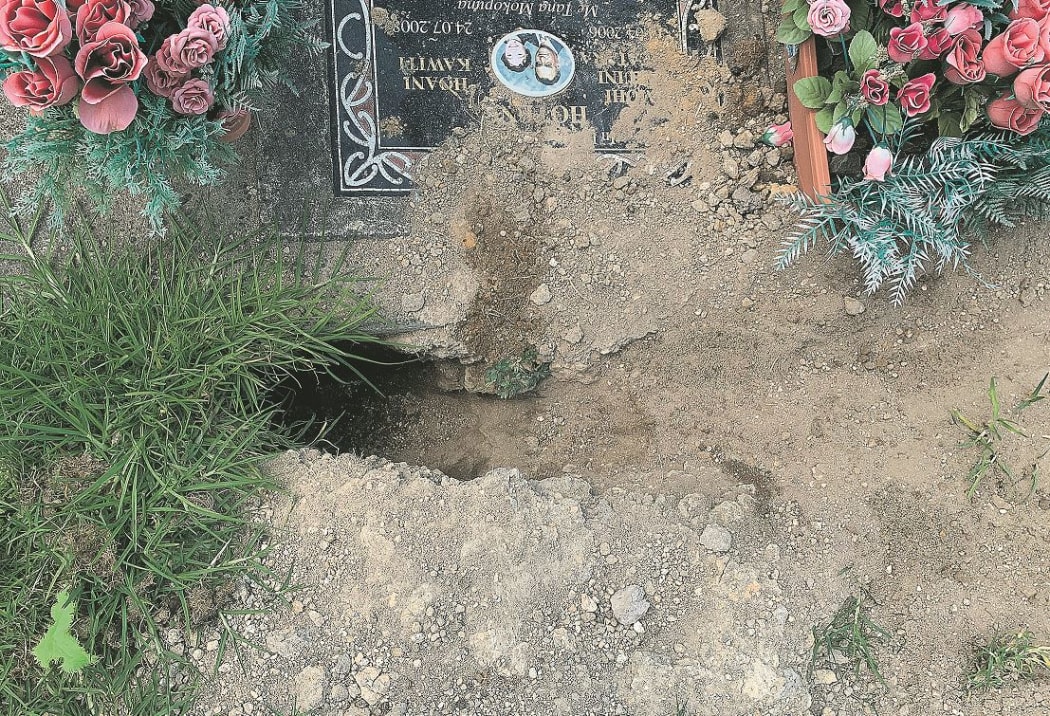 This large hole in a recent burial site was the last straw for a man sick of seeing rabbits digging up the cemetery.
