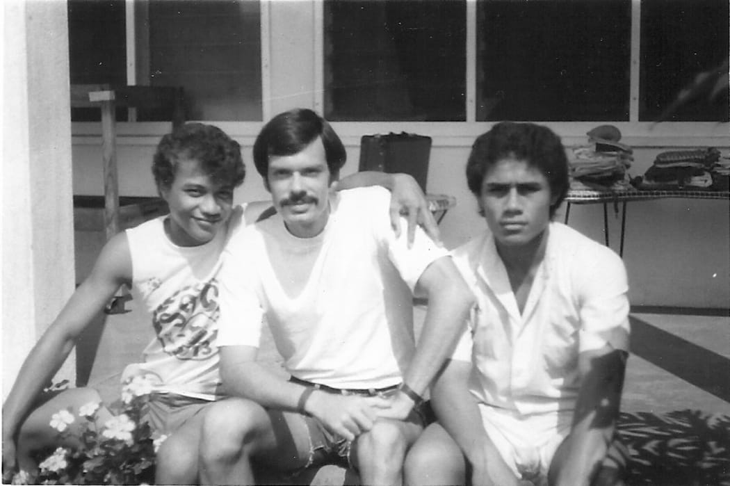 George St Clair PCV teacher with two students at Chanel College, Moamoa, (Western) Samoa, 1975.