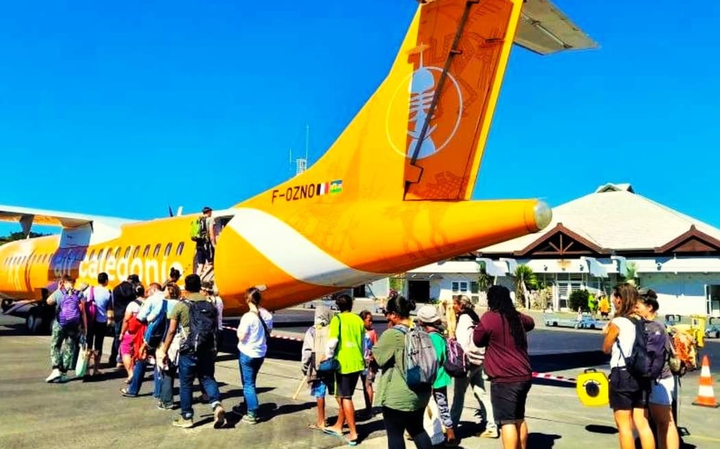 Passengers boarding Air Calédonie domestic airline ATR-72 aircraft