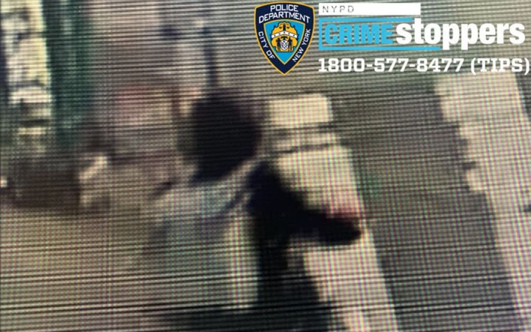 A surveillance video clip shows a person authorities believe is the suspect in Brian Thompson's killing riding an electric bike.