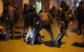 Police officers detain a protester during a rally in support of Alexei Navalny Politica in St. Petersburg, Russia, on January 23, 2021