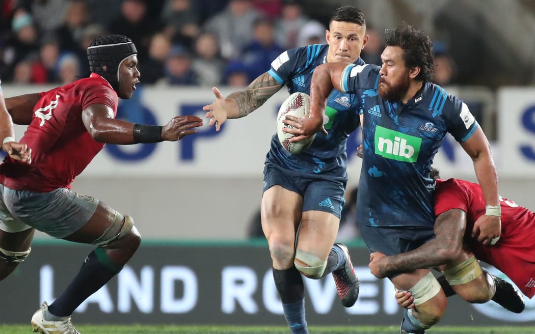Steven Luatua off-loads to Sonny Bill Williams during the Blues' win over the British and Irish Lions.