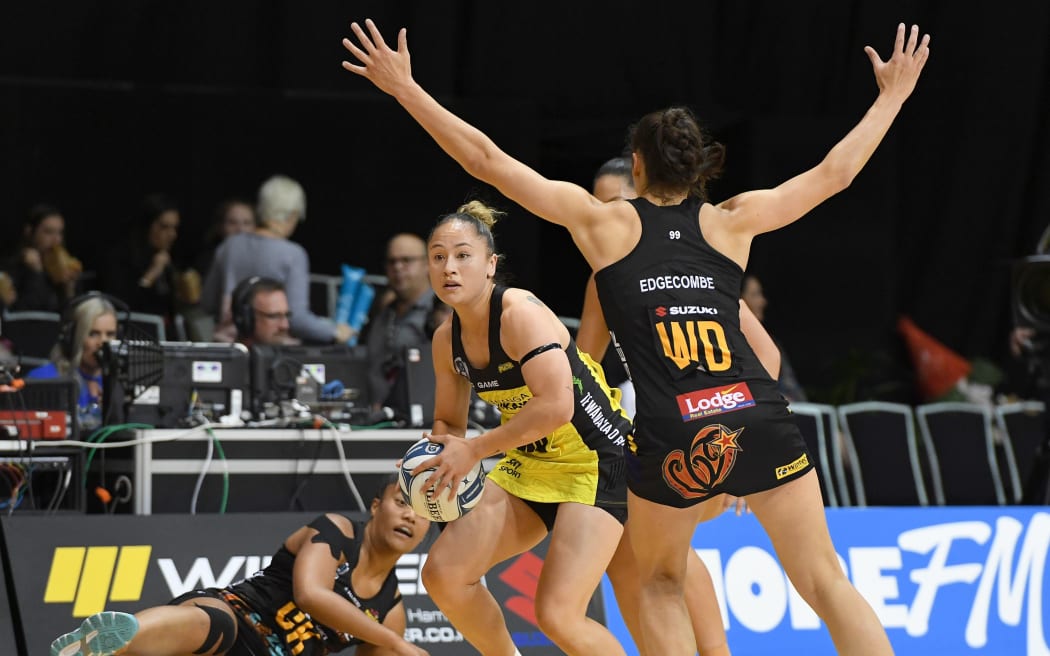 Pulse midcourter Whitney Souness looks to clear the Magic defence
