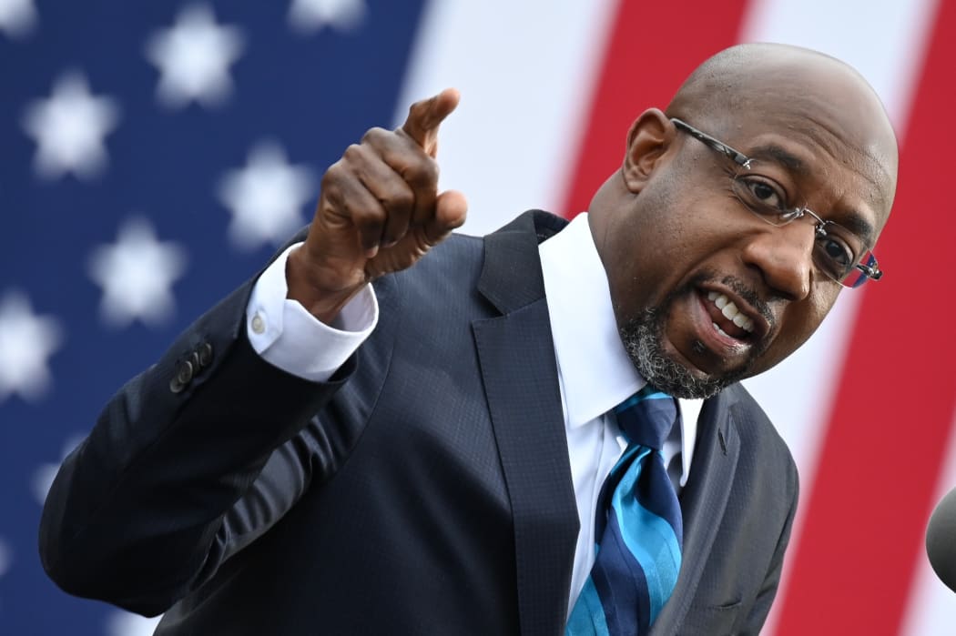 Democratic Senate candidate Reverend Raphael Warnock speaks during a campaign rally in Atlanta, Georgia on December 15, 2020.