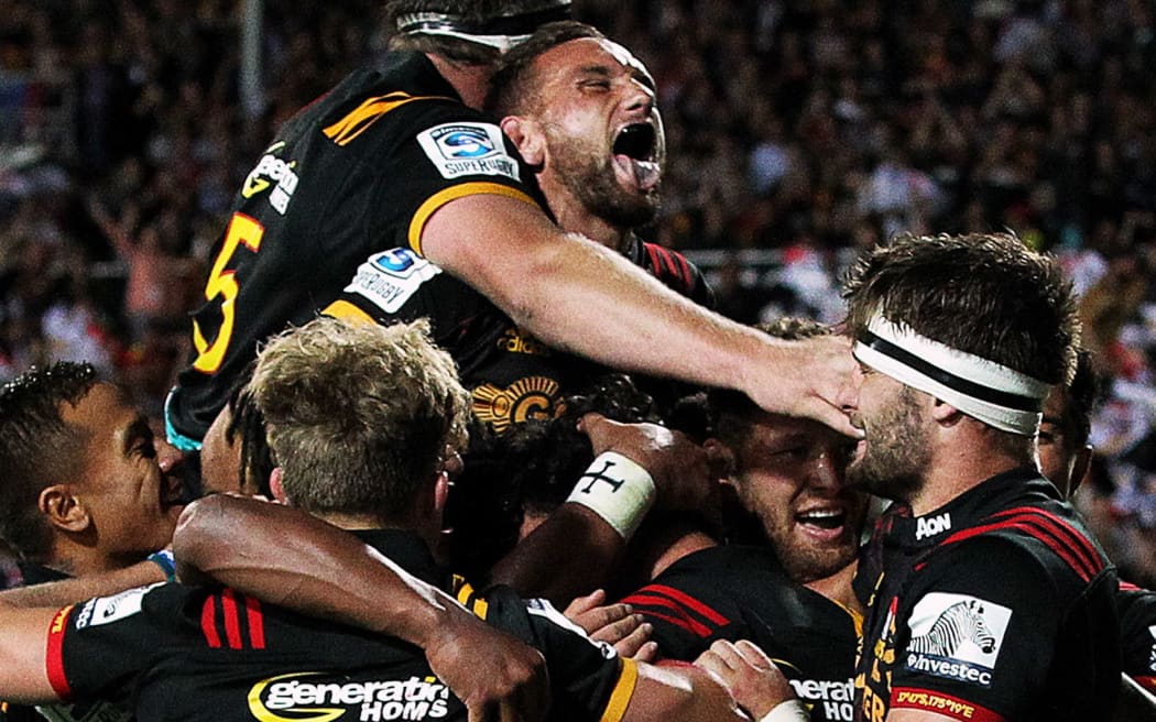 The Chiefs celebrate a try scored by Chiefs' winger James Lowe.