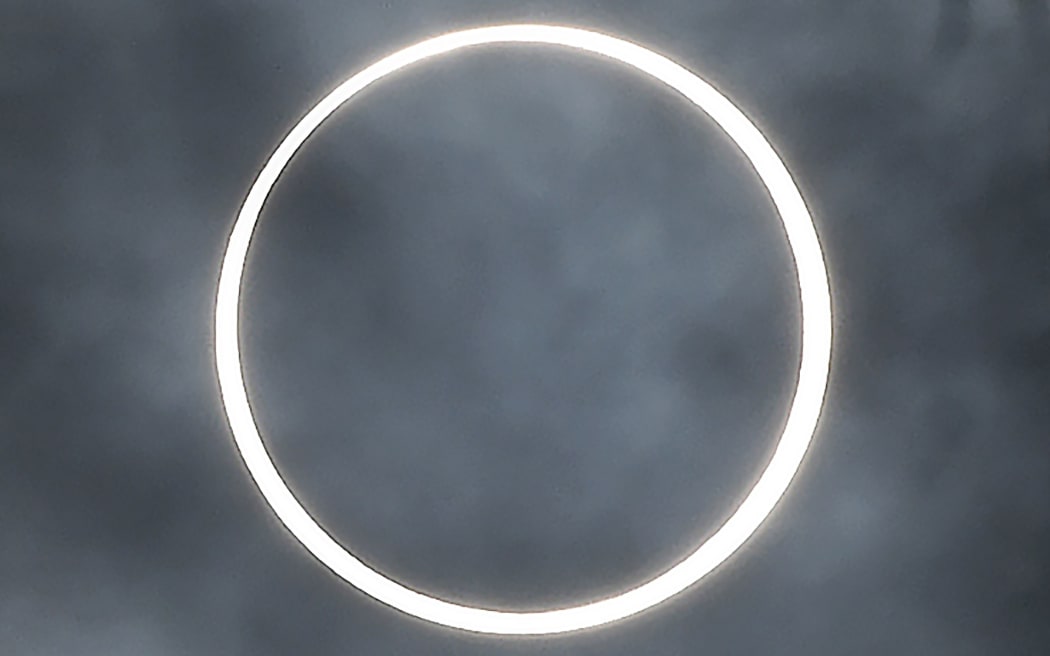 The moon totally covers the sun in a rare "ring of fire" solar eclipse as seen from the south Indian city of Dindigul in Tamil Nadu state on December 26, 2019.